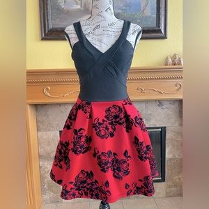 Red and black mini dress with velvety black flowers on the skirt top stretch